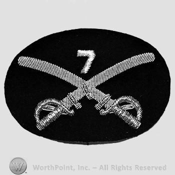 Insignia consisted of crossed swords and number 7above; embroidered.
