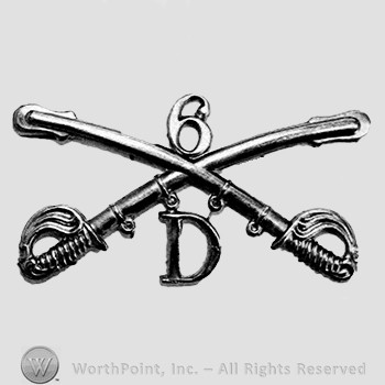 Insignia consisted of crossed swords, letter D below and number 6 above.