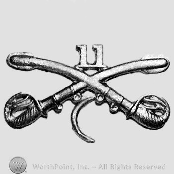 Insignia consisted of crossed sabres, number 11 above and a crescent below.
