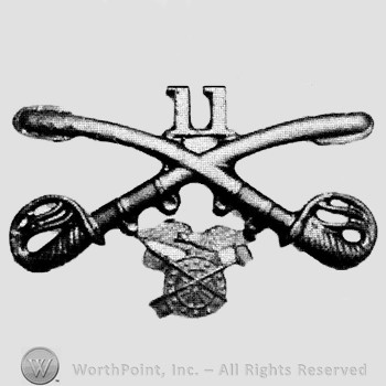 Insignia consisted of crossed sabres and number 11 above and winged wheel below.