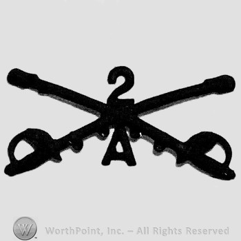 Insignia consisted of crossed sabres and number 2 above and letter A below.