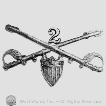 Insignia consisted of crossed sabres and number 2 above and a shield below.