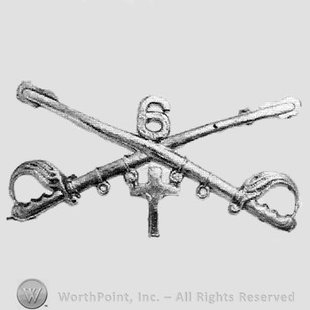 Insignia consisted of crossed sabres and number 6 above and a cross below.