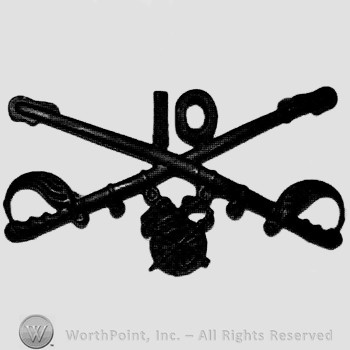 Insignia consisted of crossed sabres and number 10 above and a winged wheel below.