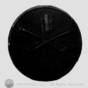 Disc with crossed sabres on and number 1 above.