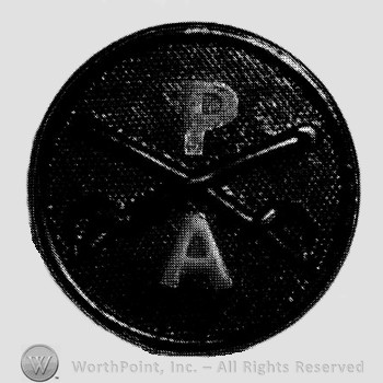 Disc with crossed sabres on and letter P above and letter A below.
