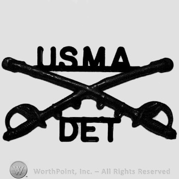 Insignia consisted of crossed sabres and letters USMA above and letters DET below.