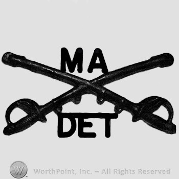 Insignia consisted of crossed sabres and letters MA above and letters DET below.