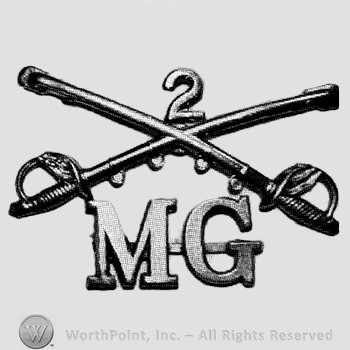 Insignia consisted of crossed sabres and number 2 above and letters MG below.