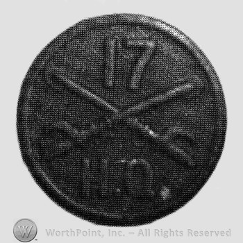 Disc with crossed sabres and number 17 above and letters HQ below.