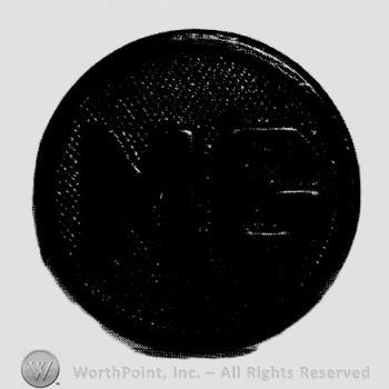Disc with letter MG on.
