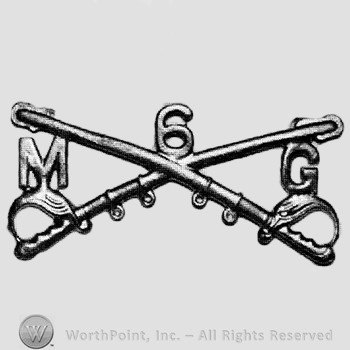 Insignia consisted of crossed sabres and number 6 above; letter M on the left and letter G on the right.