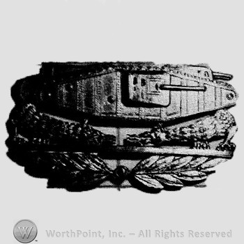 Insignia consisted of the side view of the Mark VIII Tank above two stylized dragons breathing fire over a wreath.