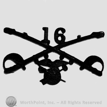 Insignia consisted of crossed sabres, number 16 above and winged wheel below.