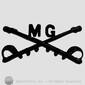 Insignia consisted of crossed sabres and letters MG at the intersection.