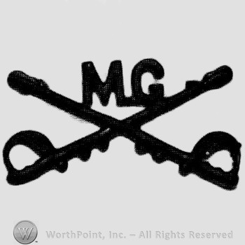 Insignia consisted of crossed sabres and letters MG at the intersection.