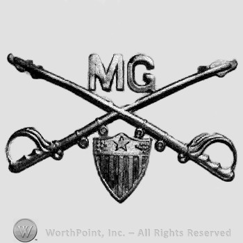 Insignia consisted of crossed sabres and letters MG at the intersection; shield below.