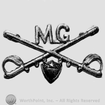 Insignia consisted of crossed sabres and letters MG at the intersection; shield below.