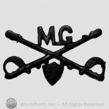 Insignia consisted of crossed sabres and letters MG at the intersection; shield below.