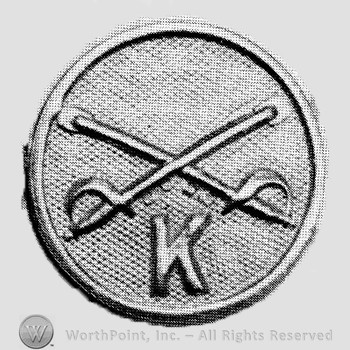Insignia consisted of collar disc with crossed sabres on and letter K below the intersection.
