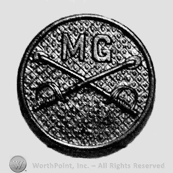 Insignia consisted of collar disc with crossed sabres on and letters MG above.