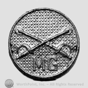 Insignia consisted of collar disc with crossed sabres on and letters  MG below the intersection.