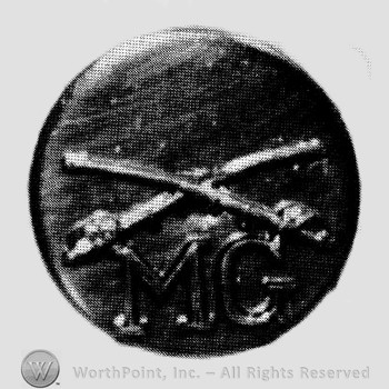 Insignia consisted of collar disc with crossed sabres on and letters  MG below the intersection.