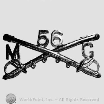 Insignia consisted of crossed sabres, number 56 above, letter M on the left and letter G on the right.