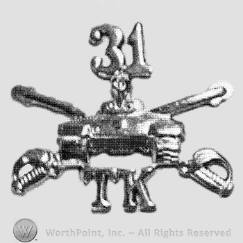 Insignia consisted of crossed sabres, front view of a tank and letters TK; number 31 above.