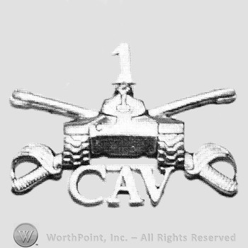 Insignia consisted of crossed sabres, front view of a tank and letters CAV; number 1 above.