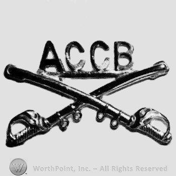Insignia consisted of crossed sabres and letters ACCB above.