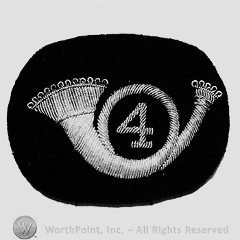 Insignia consisted of an embroidered horn with number 4 within the loop of the horn, all upon a black velvet background.