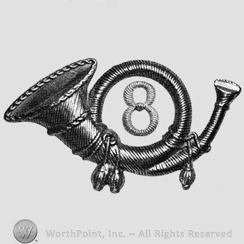 Insignia consisted of a metal horn with number 8 within thw loop of the horn.