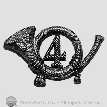 Insignia consisted of a metal horn with number 4 within thw loop of the horn.