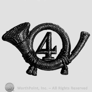 Insignia consisted of a metal horn with number 4 within thw loop of the horn.