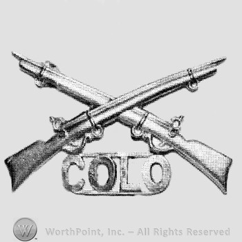 Insignia consisted of crossed rifles and letters COLD below.