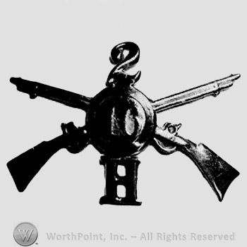 Insignia consisted of crossed riffles, shield, number 2 above and letter H below.