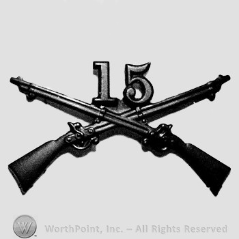 Insignia consisted of crossed rifles and number 15 above the intersection.