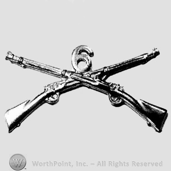 Insignia consisted of crossed rifles, number 6 above the intersection.