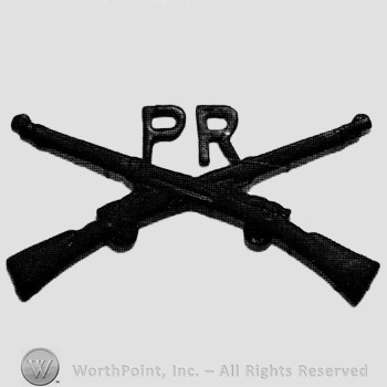 Insignia consisted of crossed rifles, letters PR above the intersection.