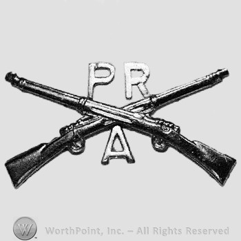 Insignia consisted of crossed rifles, letters PR above the intersection and letter A below.