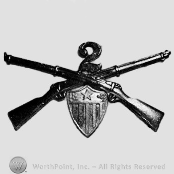 Insignia consisted of crossed rifle, number 2 above the intersection and a shield below.