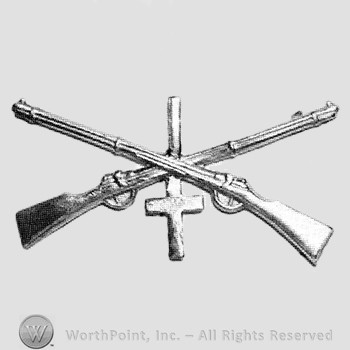 Insignia consisted of crossed rifle, number 1 above the intersection and a cross below.