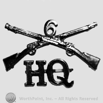 Insignia consisted of crossed rifles, number 6 above the intersection and letters HQ below.