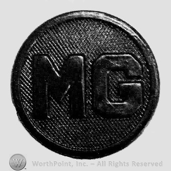 Insignia consisted of a disc with letters MG on.