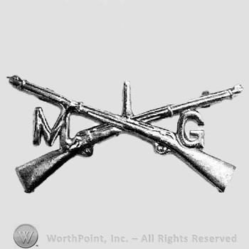 Insignia consisted of crossed rifles and letters M and G an the left and on the right.