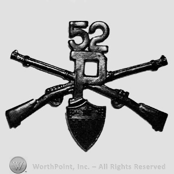 Insignia consisted of crossed rifles, letter P in the center, shield below  and number 52 above.