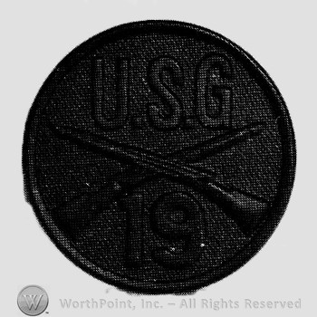 Insignia consisted of crossed rifles, letters USG above the intersection and number 19 below; all on a disc.