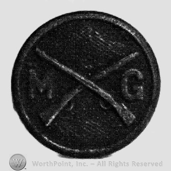 Insignia consisted of crossed rifles, letters M and G on the left and on the right; all on a disc.