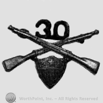 Insignia consisted of crossed rifles, number 30 above the intersection and a shield below.